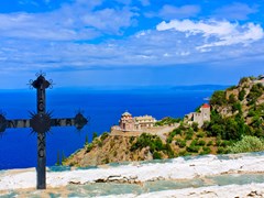 Iron-cross-against-a-blue-sky-on-Mount-Athos,-Greece