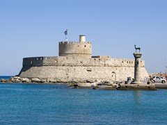 01_Harbour-Gates-and-Lighthouse-St.-Nicholas-at-Rhodes,-Greece.-There-are-also-two-bronze-deer.-Erected-where-probably-the-famous-Colossus-of-Rhodes-used-to-stand