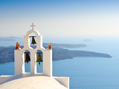 20_Bell-tower-of-church-above-the-beautiful-blue-bay-at-Santorini,Greece