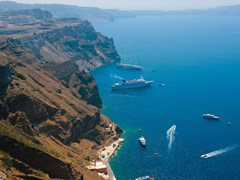 38_Caldera-view-on-island-of-Santorini,-Greece-in-Aegean-sea-with-big-and-small-commercial-passenger-ships.