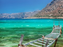 small-Old fishing bridge in turquoise lagoon. Balos bay, Crete, Greece.